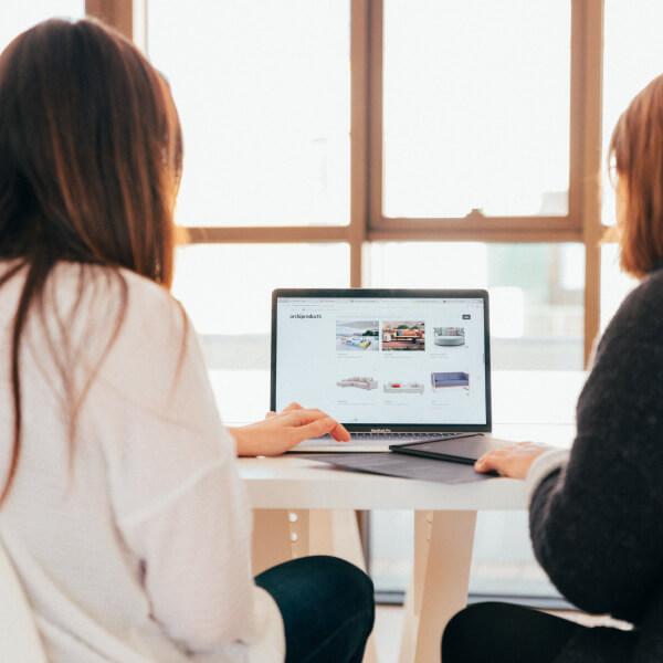image of two women looking at a website archive